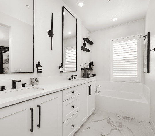 Sleek bathroom design featuring white and black decor