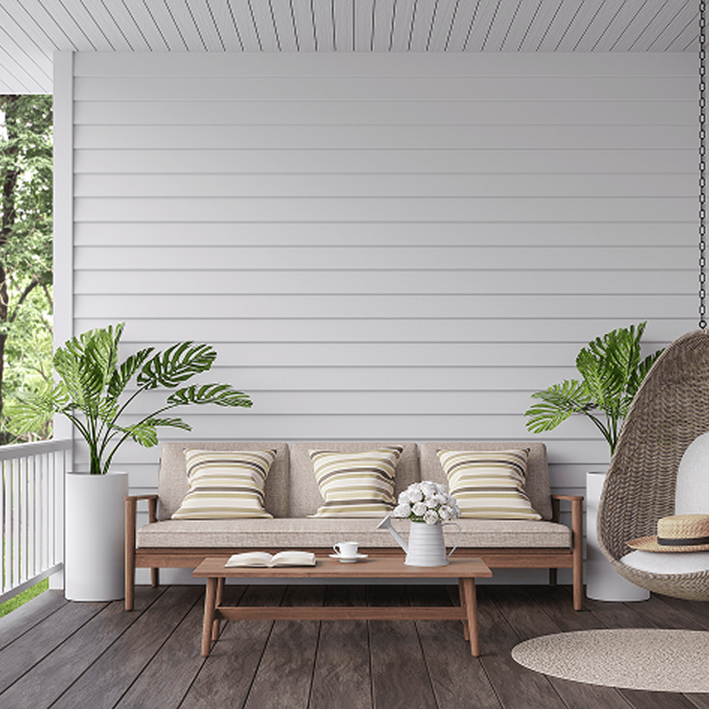 Modern terrace featuring potted plants and seating.